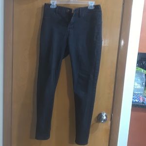 Pair of light washed black jeggings